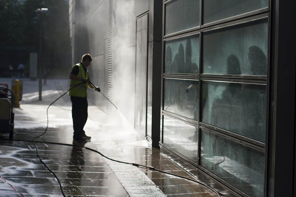 pressure cleaning professional spraying commercial concrete